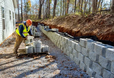 Concrete Pro LA team member building a retaining wall
