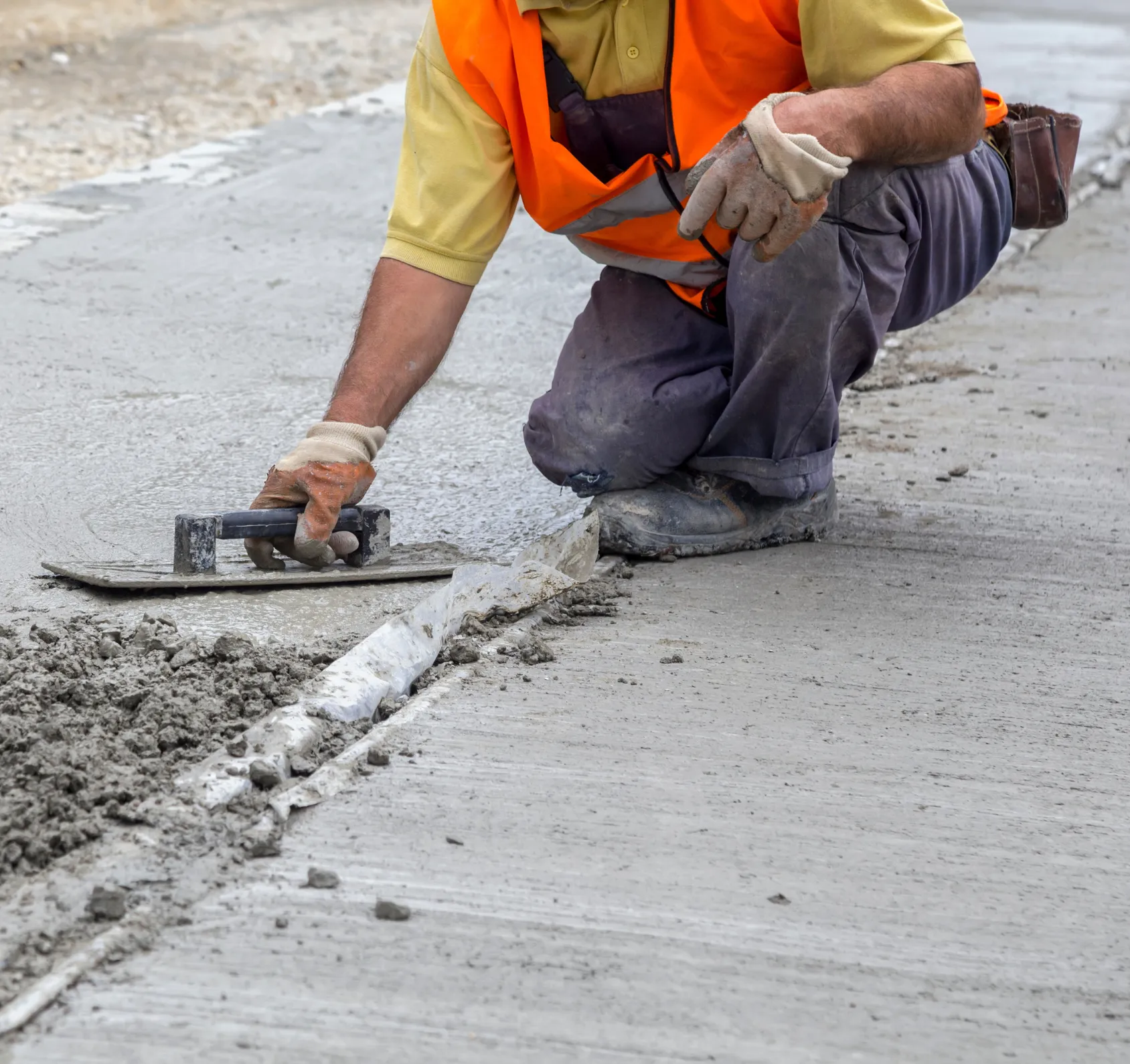 Concrete Pro LA team member leveling wet concrete on site